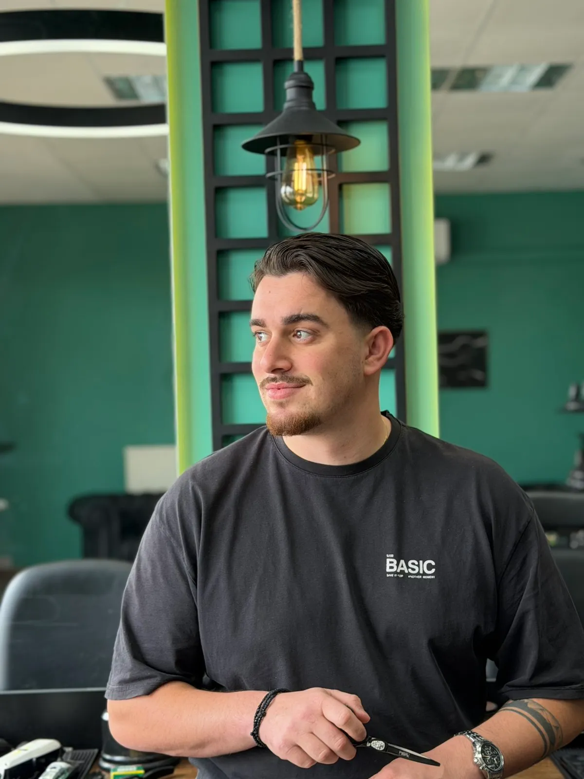 Thomas, barber at Hair Studio Papounidis in Agios Athanasios, Drama